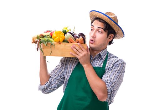 Young farmer with fresh produce isolated on white background