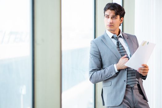 Young successful businessman working at the office 