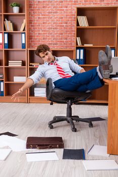Unhappy businessman sitting in the office 