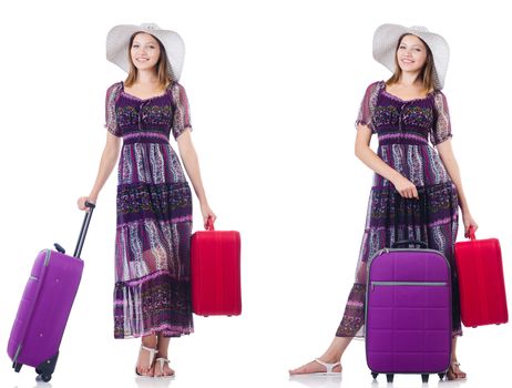 Young woman with suitcases isolated on white