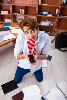Unhappy businessman sitting in the office 