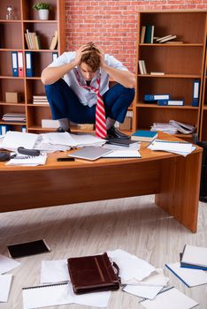 Unhappy businessman sitting in the office 