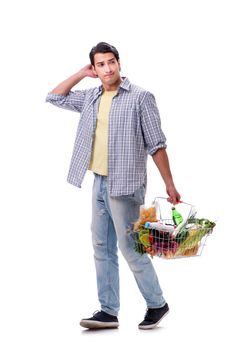 Young man with his grocery shopping on white
