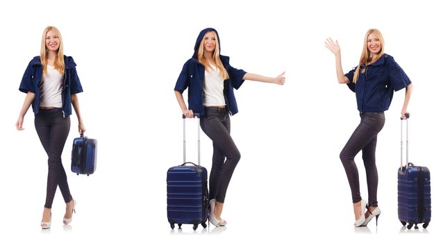 Beautiful woman with suitcase in vacation concept 