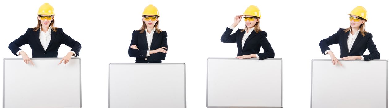 Young female builder with whiteboard 