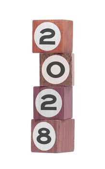 Four isolated hardwood toy blocks on white, saying 2028