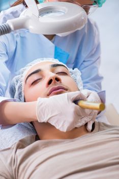 Man visiting dermatologyst for laser scar removal  