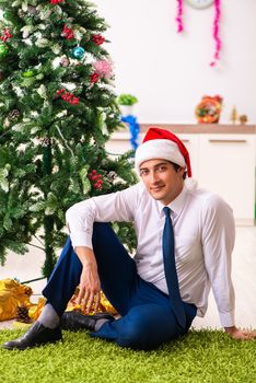 Employee businessman celebrating christmas in office