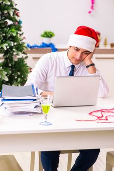 Employee businessman celebrating christmas in office