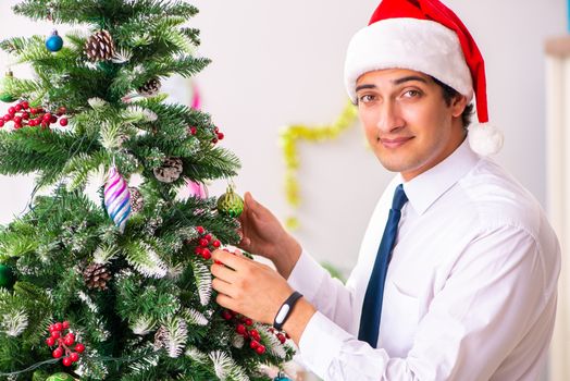 Employee businessman celebrating christmas in office