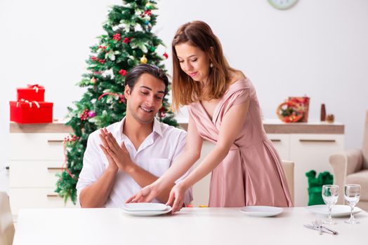 Young couple preparing for christmas meal