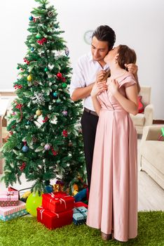 Young couple celebrating christmas at home