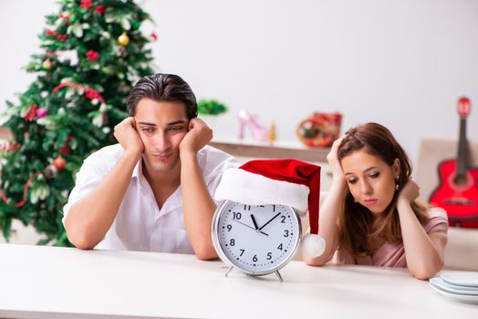 Young couple celebrating christmas at home