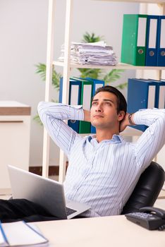 Young employee sitting at the office 