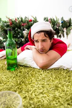 Young man drunk at home after christmas party