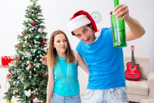 Young family celebrating christmas at home