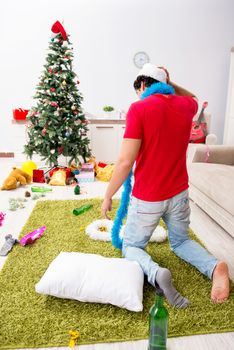 Young man drunk at home after christmas party