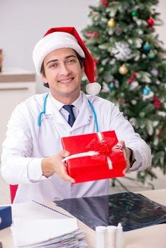 Doctor with gift box in the hospital