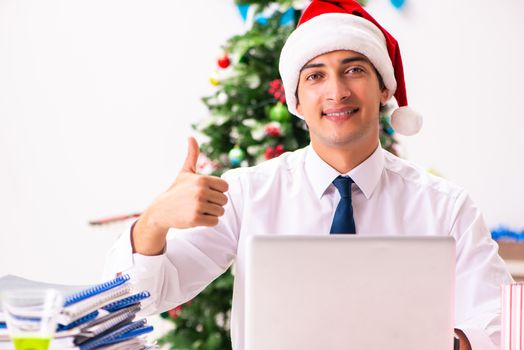 Employee businessman celebrating christmas in office