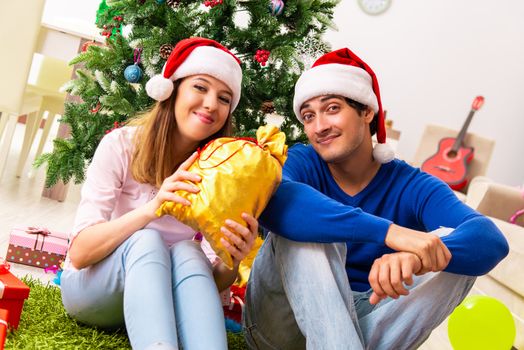 Young couple celebrating christmas at home