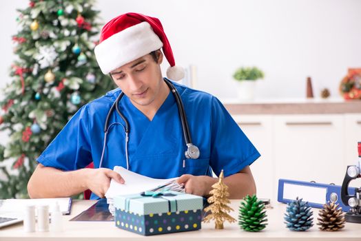 Doctor with gift box in the hospital