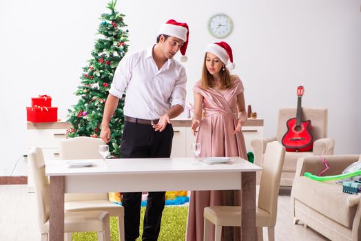 Young couple preparing for christmas meal