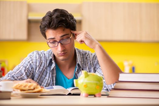 Student preparing for exam sitting at the kitchen 
