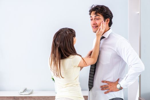 Woman sees her husband off to work 