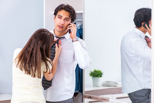 Woman sees her husband off to work 