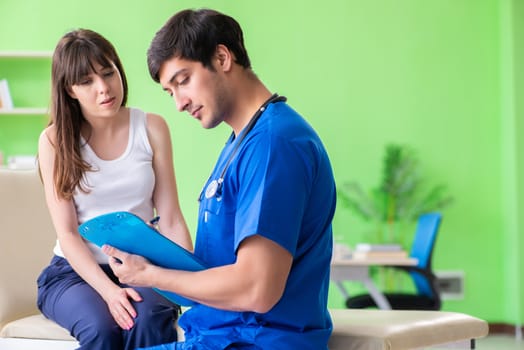 Female patient visiting male doctor in medical concept 