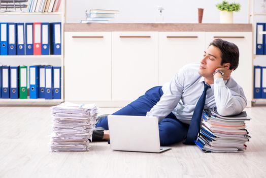 Extremely busy employee working in the office