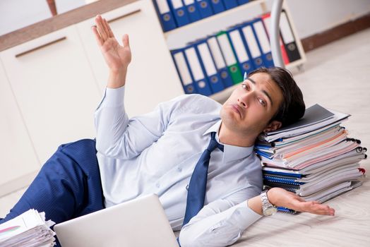 Extremely busy employee working in the office