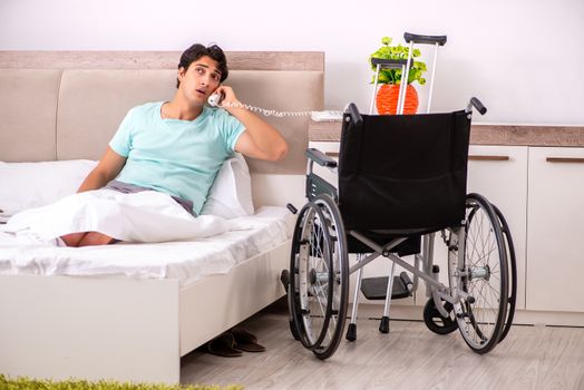 Young handsome disabled man recovering at home 