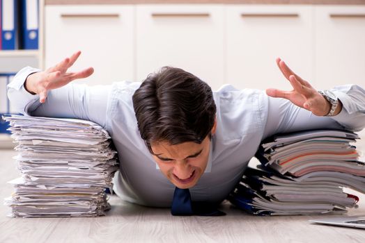 Extremely busy employee working in the office