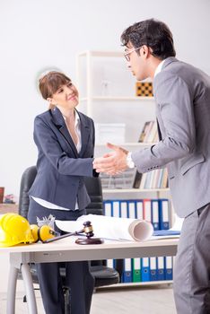 Man and woman discussing construction project