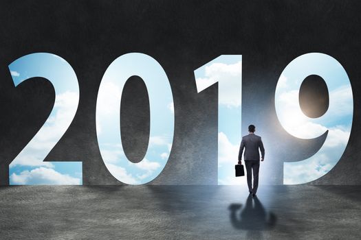 Businessman in the concept of transition to year 2019