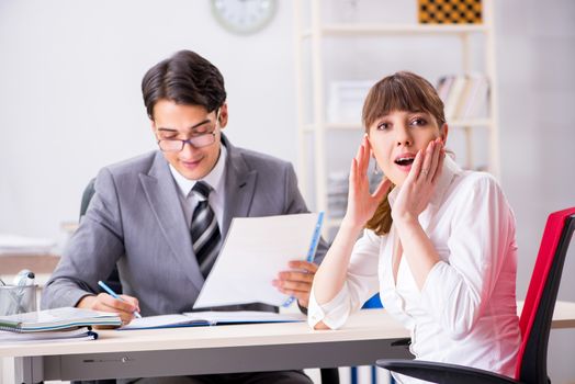 Man and woman discussing in office