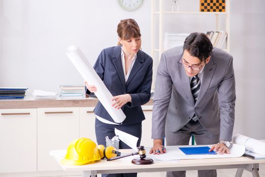 Man and woman discussing construction project