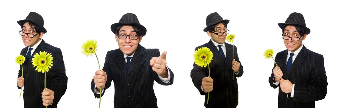 Young man in black costume with flower isolated on white