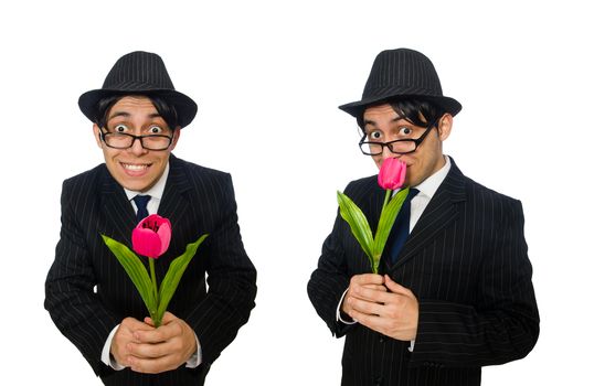 Young man in black costume with flower isolated on white