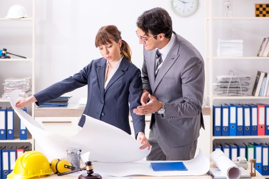 Man and woman discussing construction project