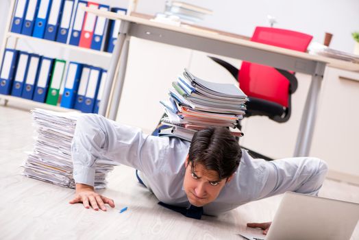 Extremely busy employee working in the office