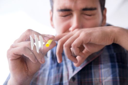 Drug addict sniffing cocaine narcotic