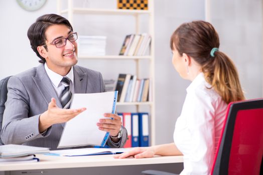 Man and woman discussing in office