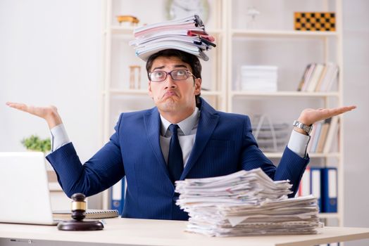 Young handsome judge working in court