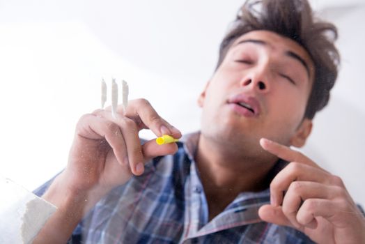 Drug addict sniffing cocaine narcotic