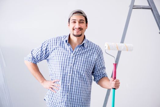 Young painter doing renovation at home 