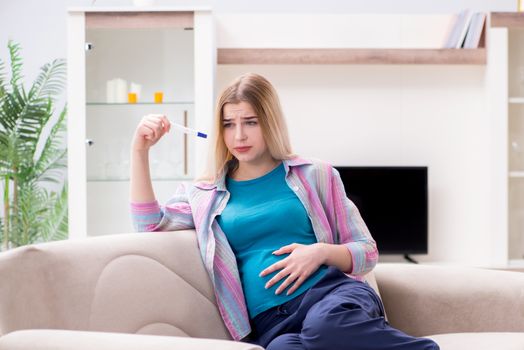 Young woman finding out about her pregnancy