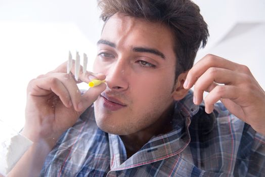 Drug addict sniffing cocaine narcotic