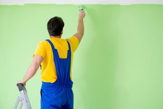 Young painter doing renovation at home 